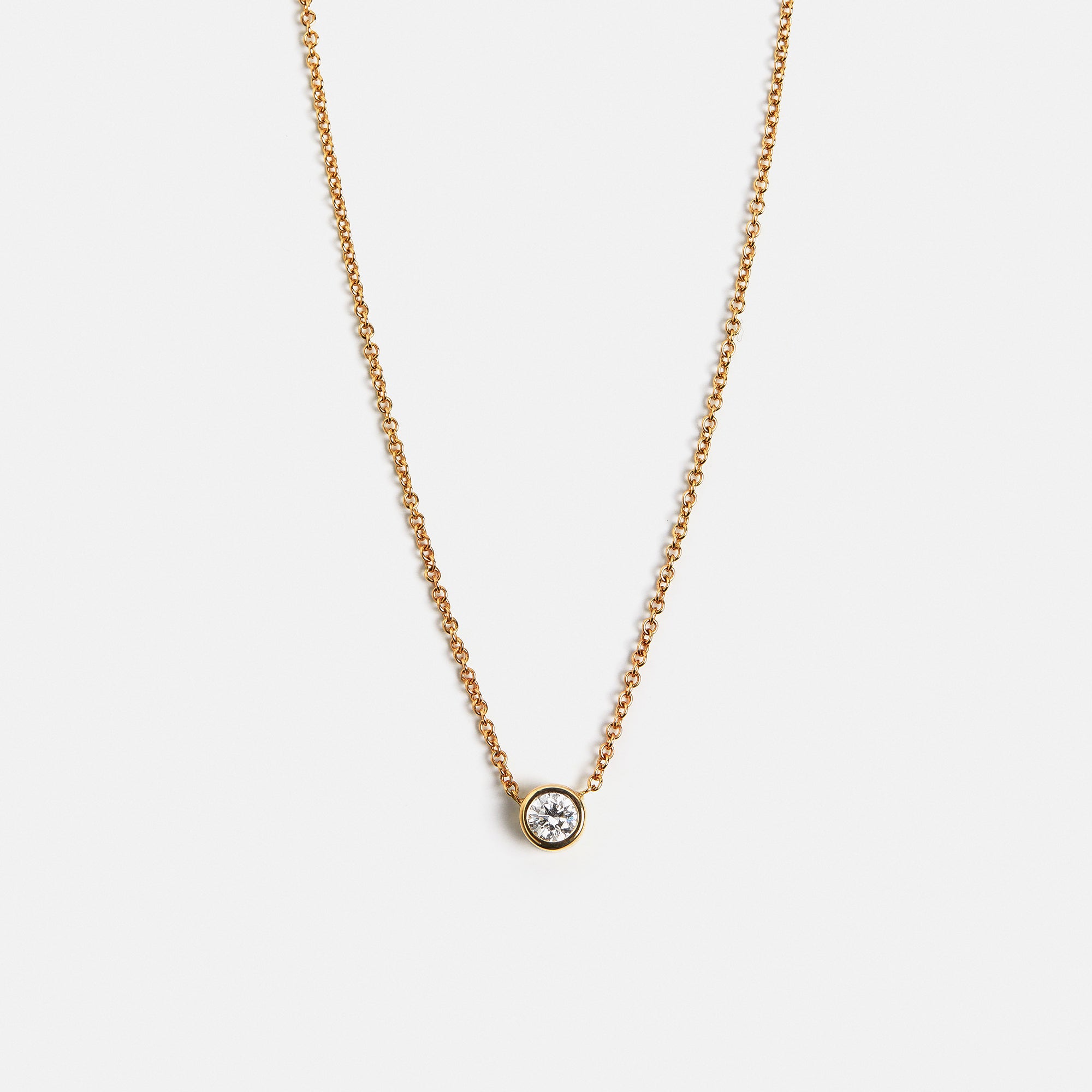Modern dainty necklace with bezel set peridot pendant in solid gold, handmade by SHW jewelry NYC