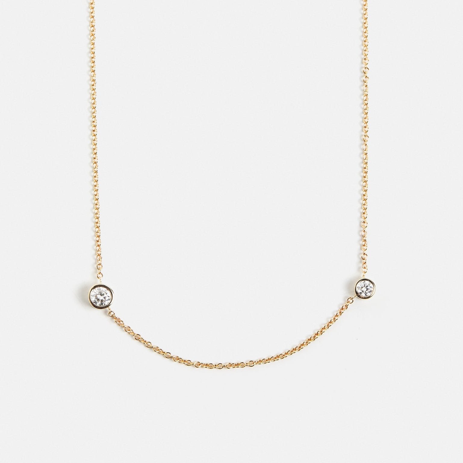 Cool necklace with delicate chain and asymmetrical lab created white diamonds in 14 karat gold by SHW best fine jewelry store in NYC