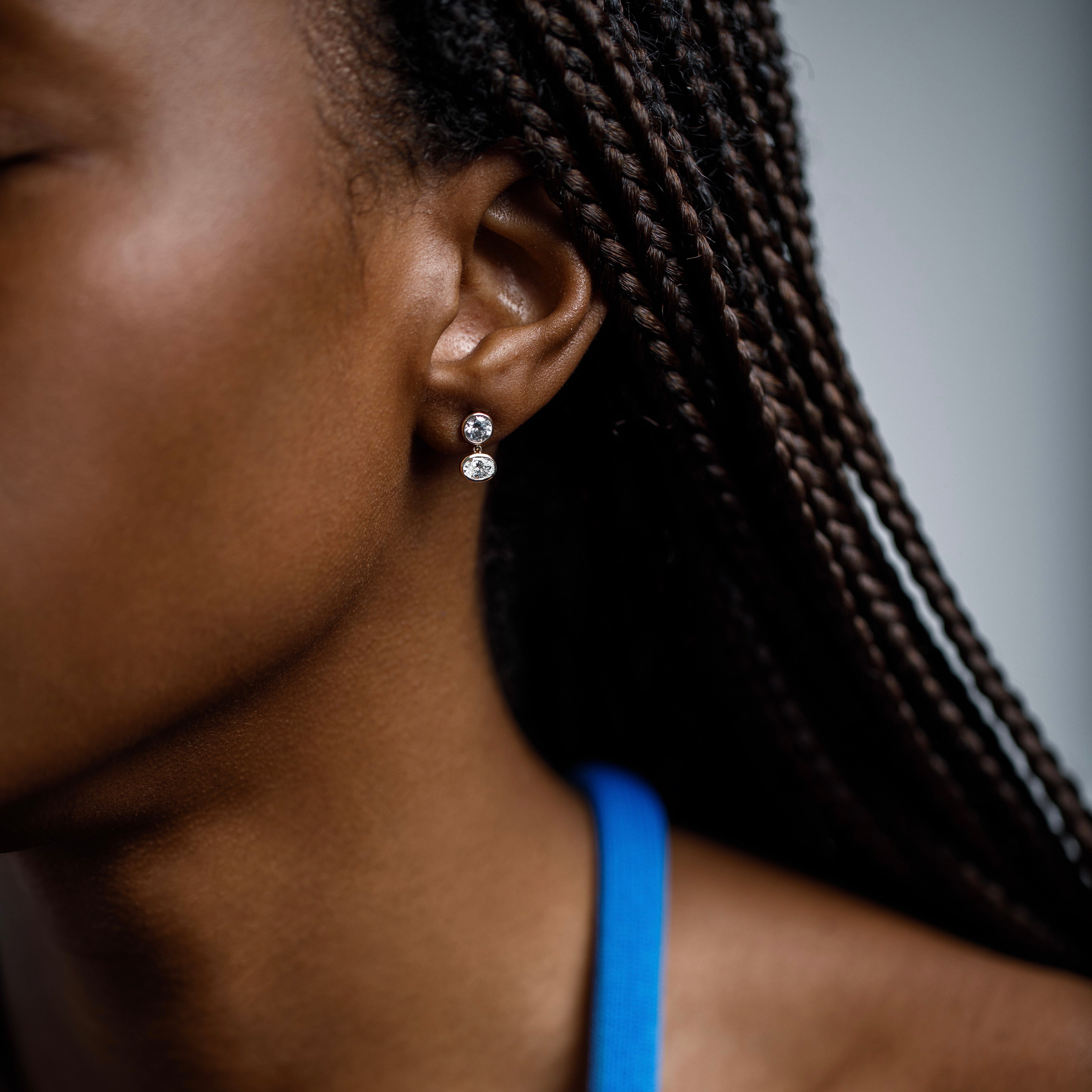 Minimalist dangling stud earrings with round and oval lab created white diamonds in 14k or 18k gold by SHW cool fine jewelry shop in NYC