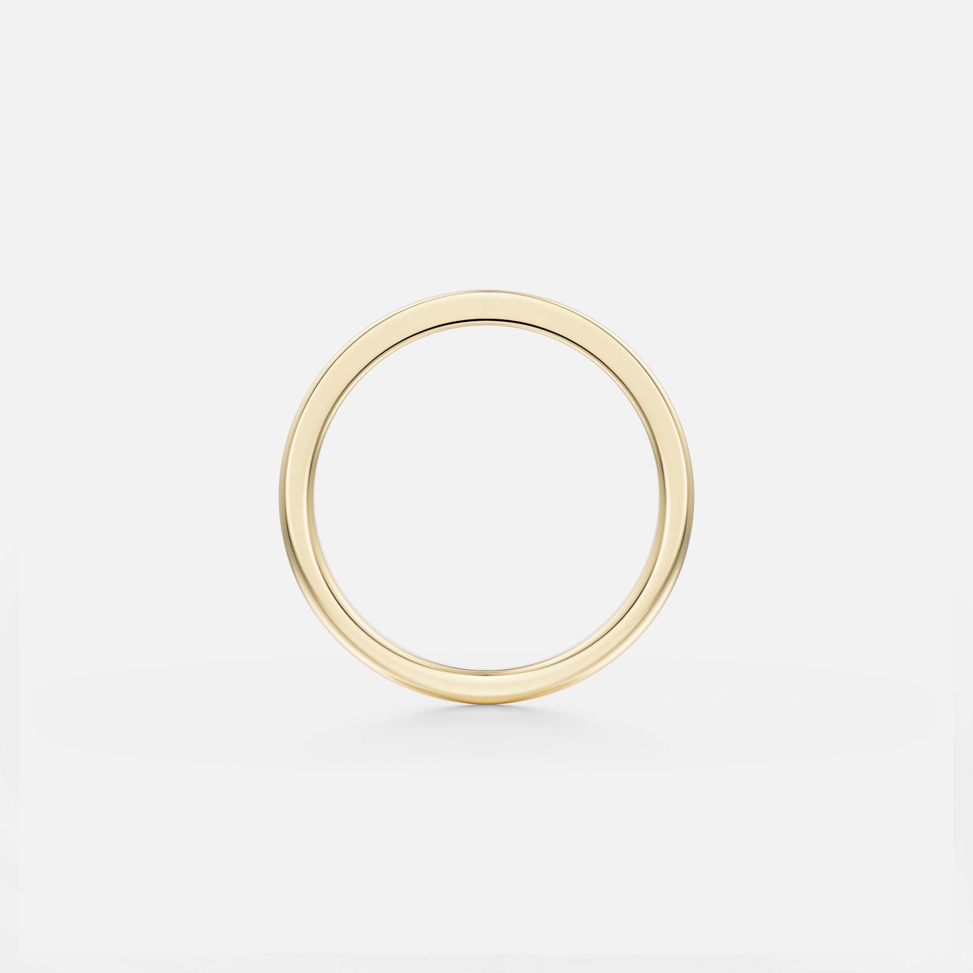 Thin gold wedding band with contrasting flat and rounded profile