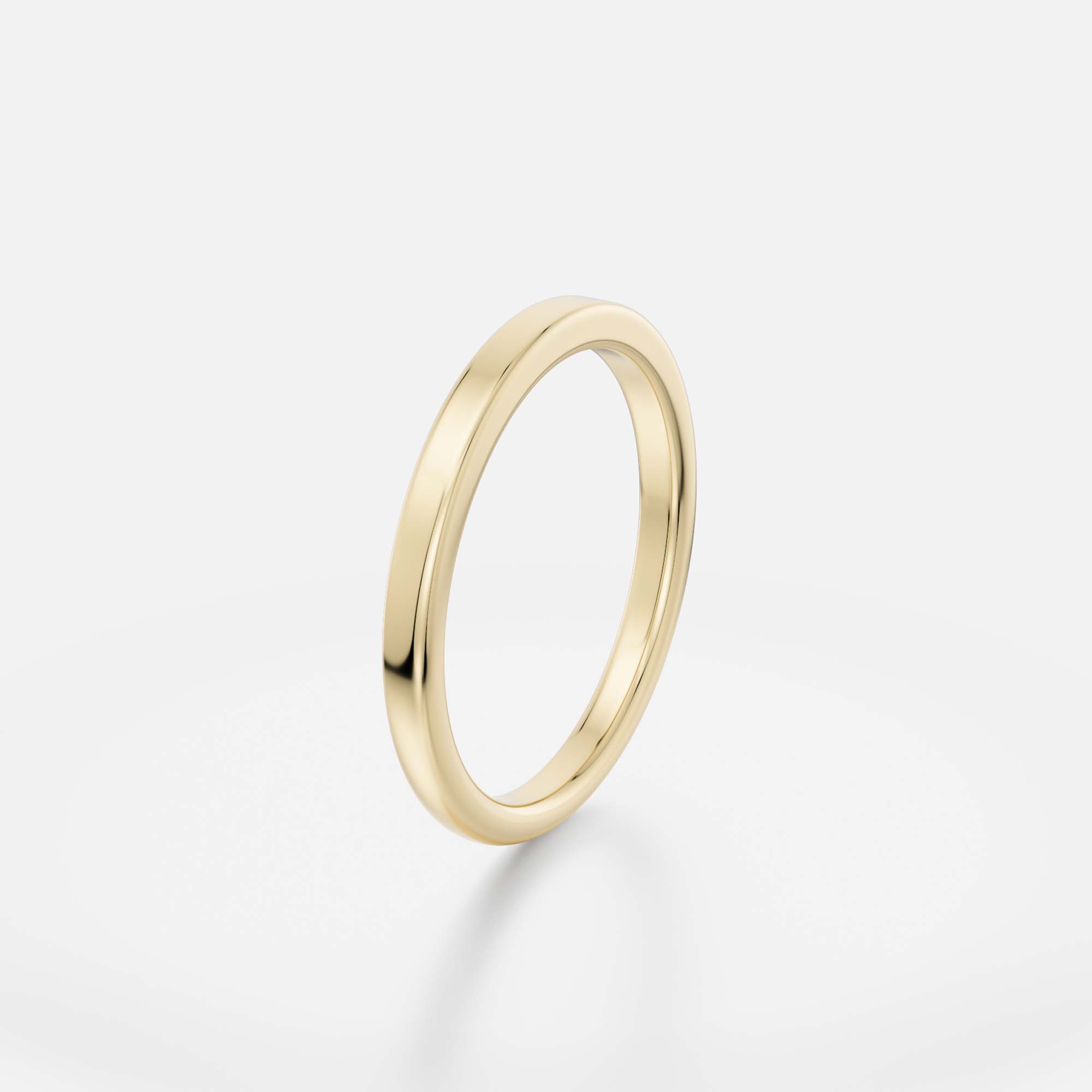 Slim gold band showing transition between flat and domed surfaces