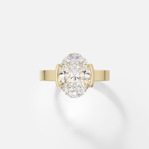 14k yellow gold engagement ring with 3.00 carat oval diamond set north-south in tapered partial bezel on wide flat band