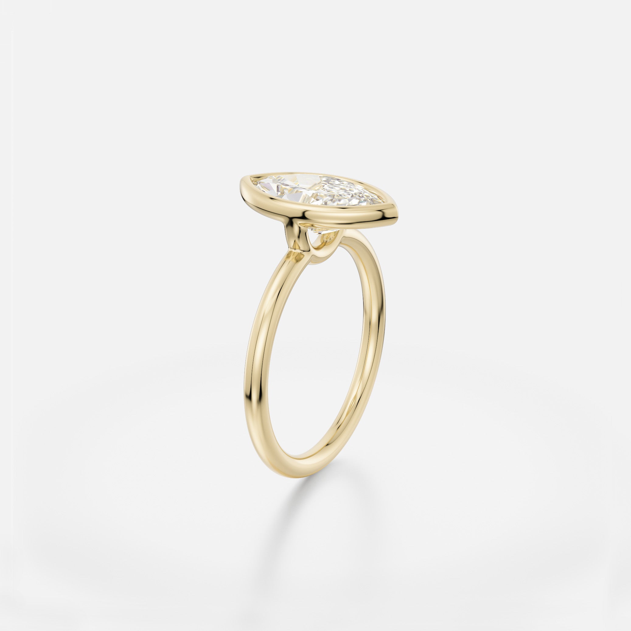 Delicate round profile band engagement ring with 2 ct marquise diamond in minimalist bezel