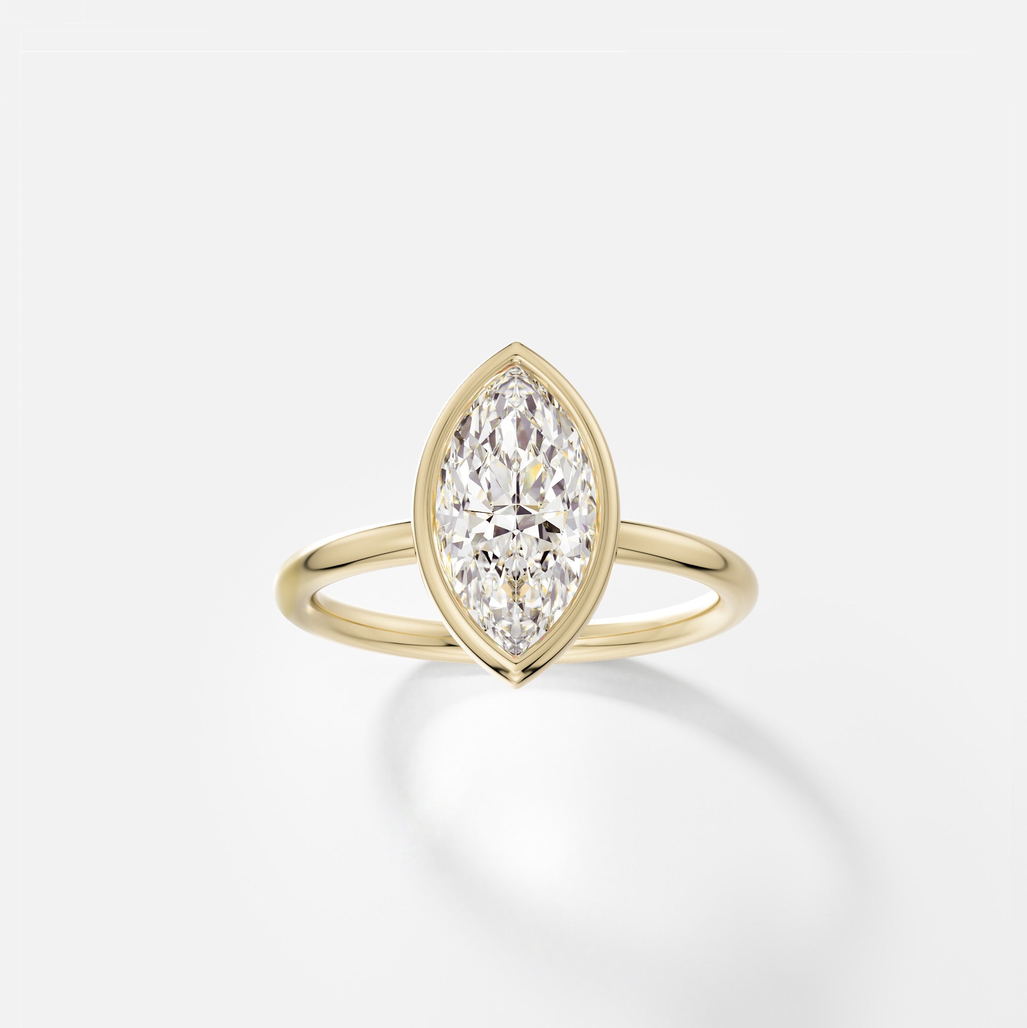 14k yellow gold engagement ring with 2 carat marquise diamond set north south in thin bezel on delicate round band