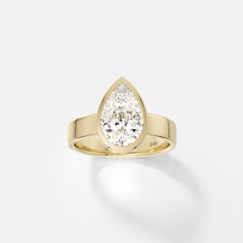 14k yellow gold wide flat band engagement ring with 2.00 carat pear diamond set north south in thin bezel