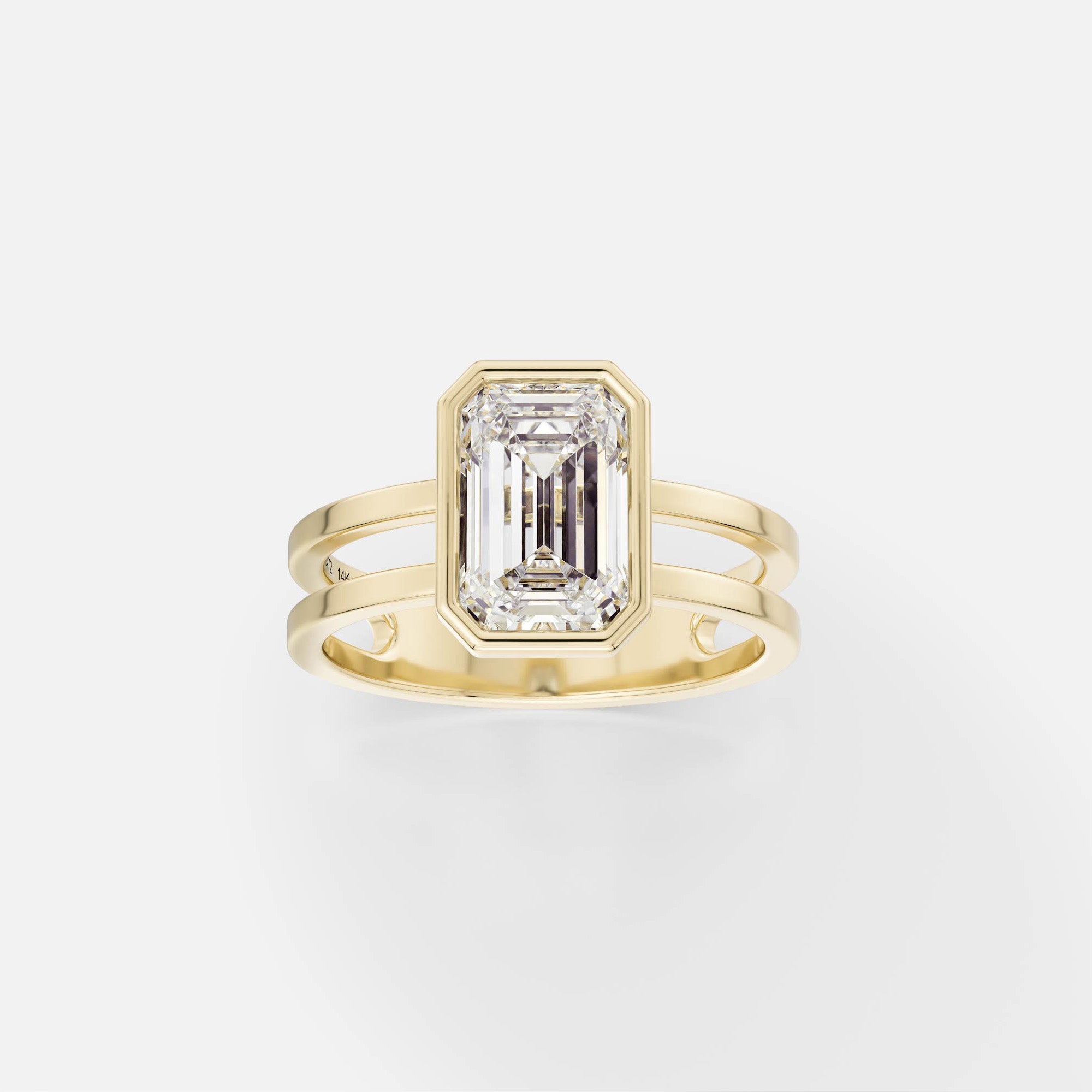 14k yellow gold double band engagement ring with 2 carat emerald-cut diamond in thin bezel setting