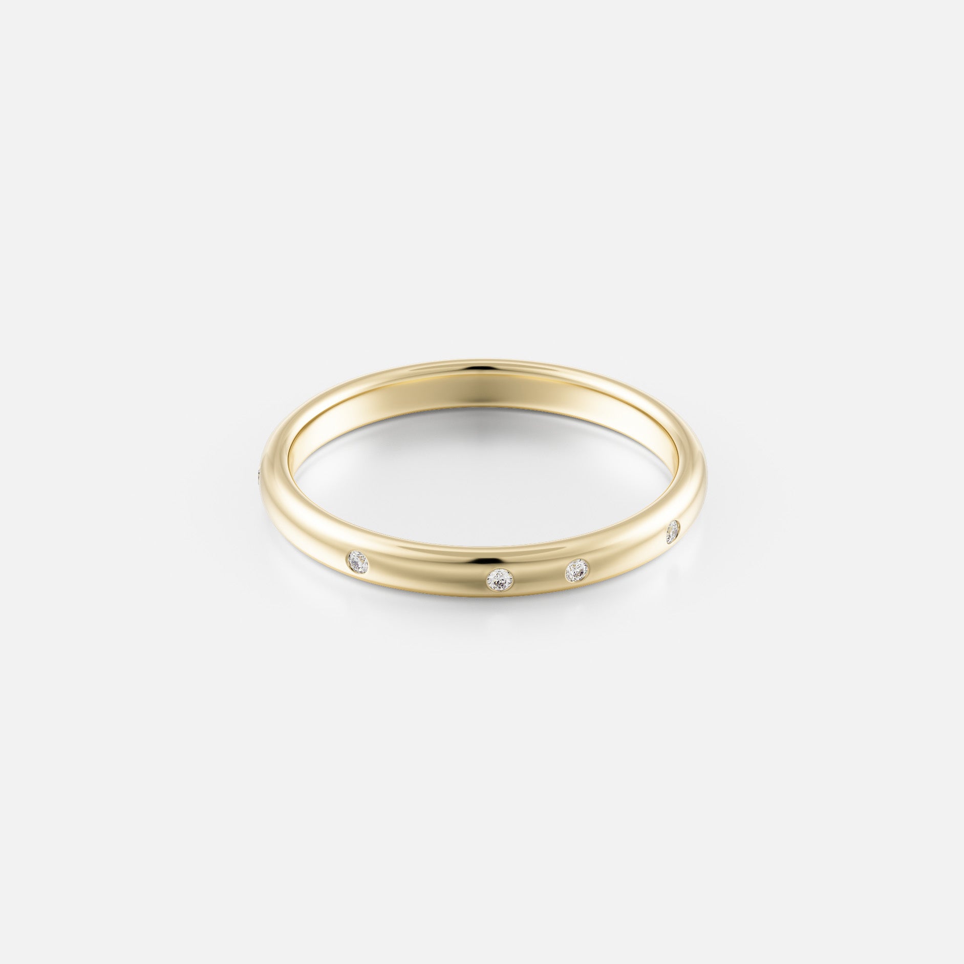 14k yellow gold wedding band with irregularly spaced round diamonds