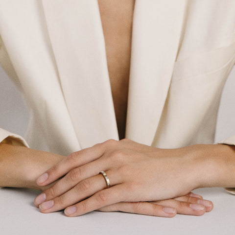 Asymmetrical princess diamond band shown worn in natural light