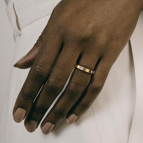 Minimal asymmetrical diamond band shown worn in natural light