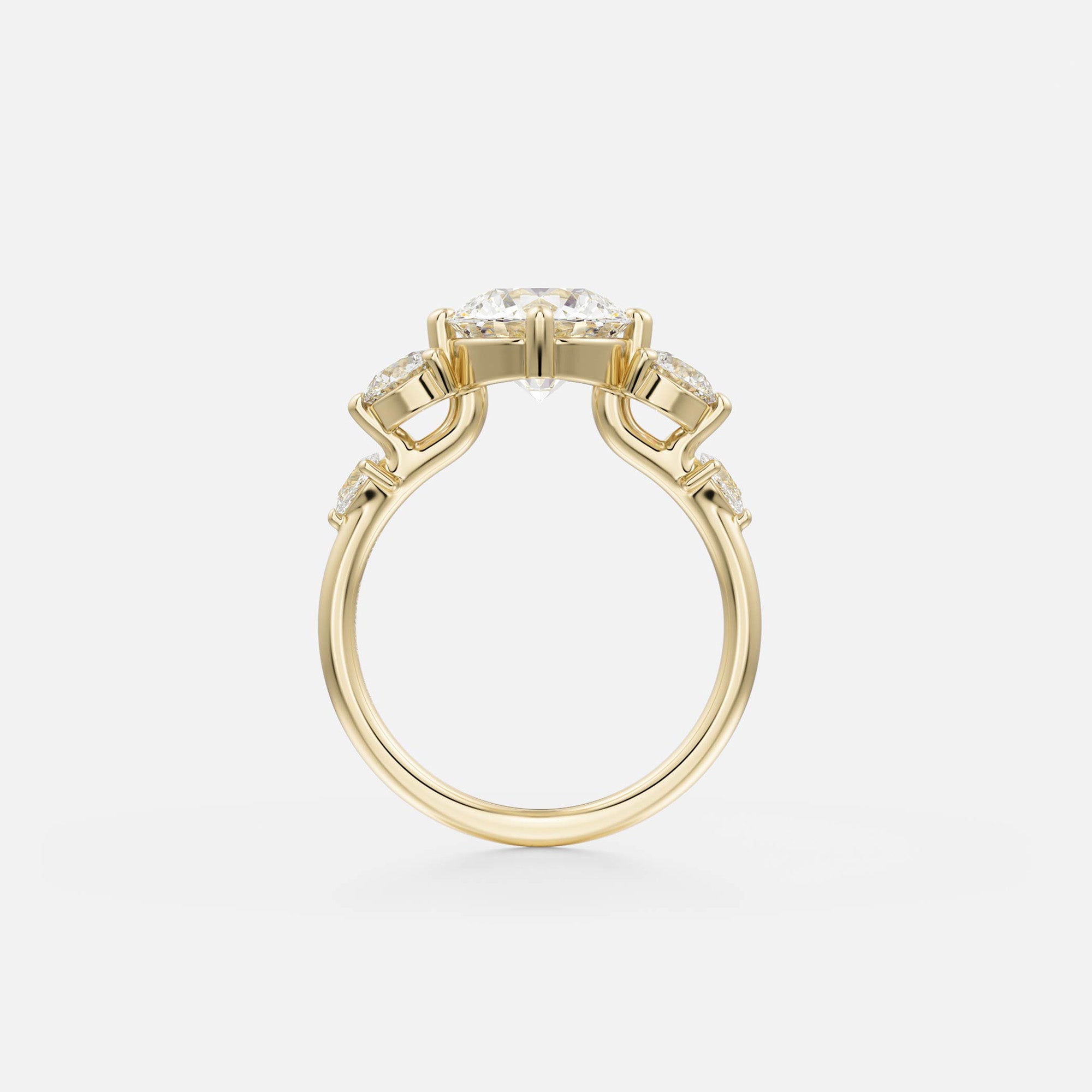 side view of round brilliant diamond five stone engagement ring with pear and round accent stones on thin round band