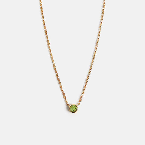 Dainty chain necklace with round peridot pendant, August birthstone, set in solid 14k gold by SHW fine jewelry store NYC
