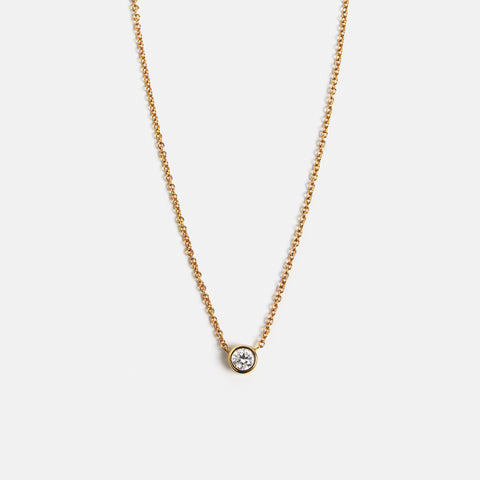 Modern dainty necklace with bezel set peridot pendant in solid gold, handmade by SHW jewelry NYC