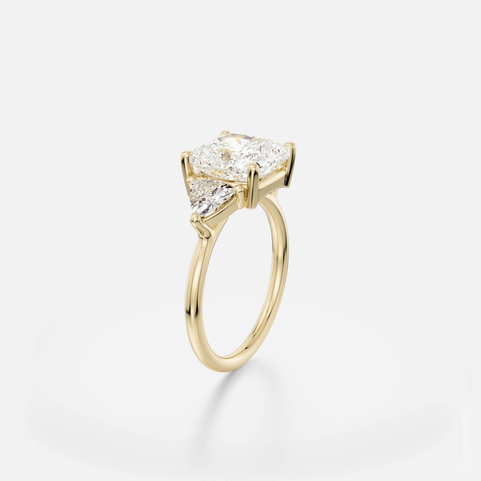 3.50 carat cushion-cut diamond engagement ring with trillion-cut side stones in delicate prong cluster setting on round band