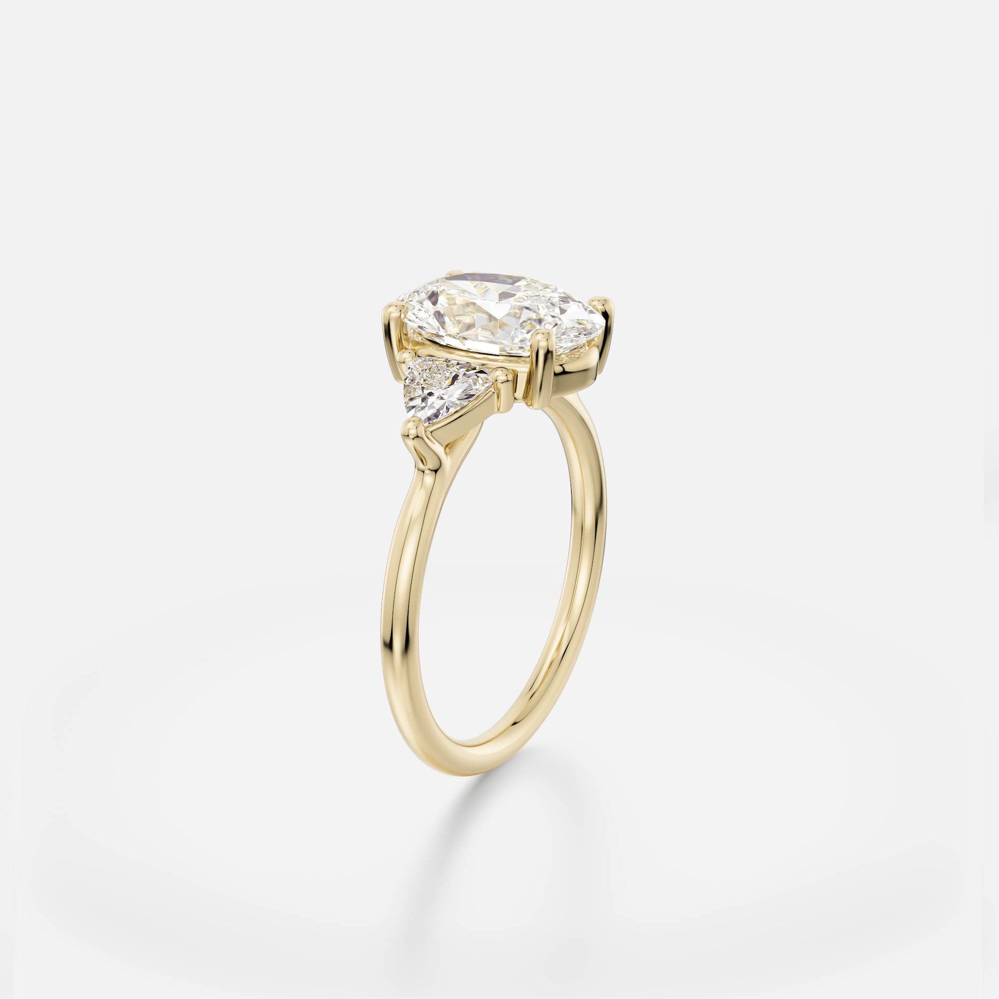 2.50 carat oval diamond engagement ring with trillion side stones in delicate prong cluster setting