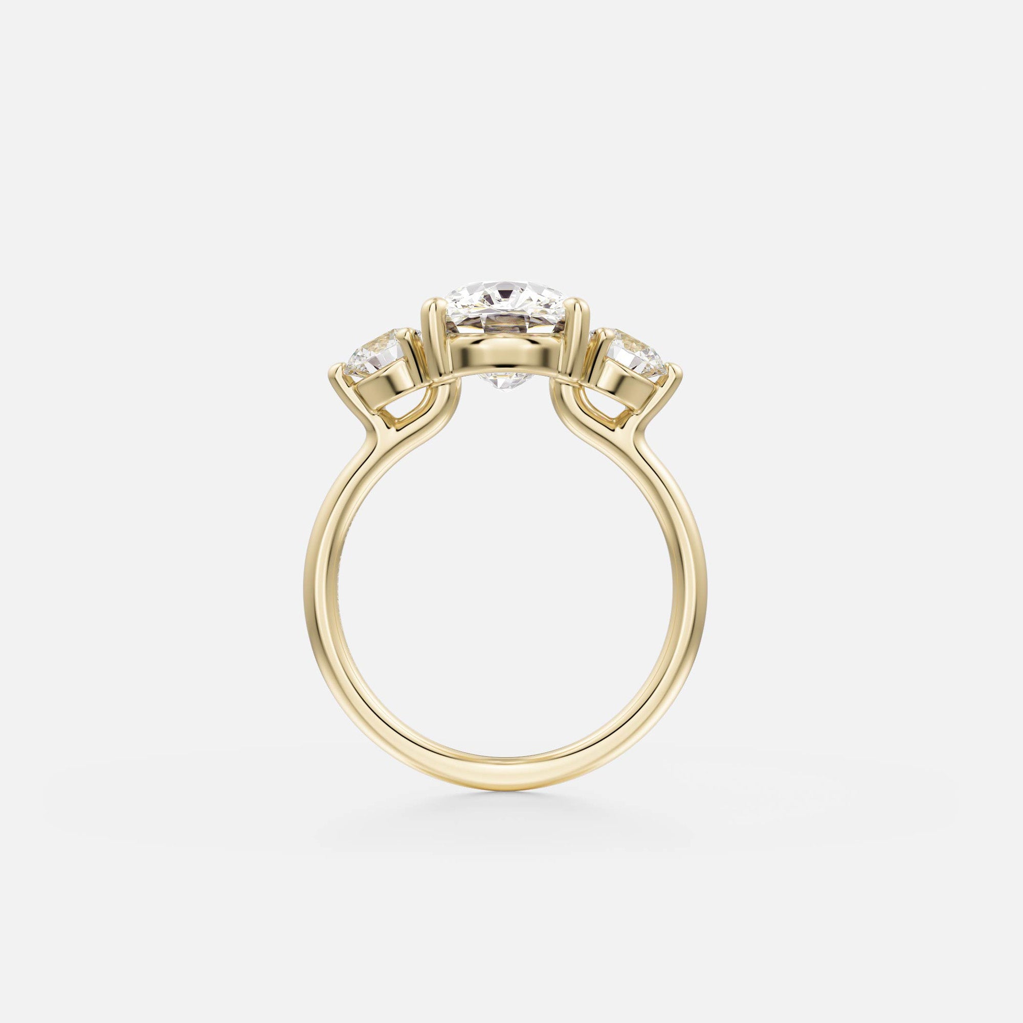 Kala elongated cushion diamond three stone engagement ring with round side stones side view in 14ky gold