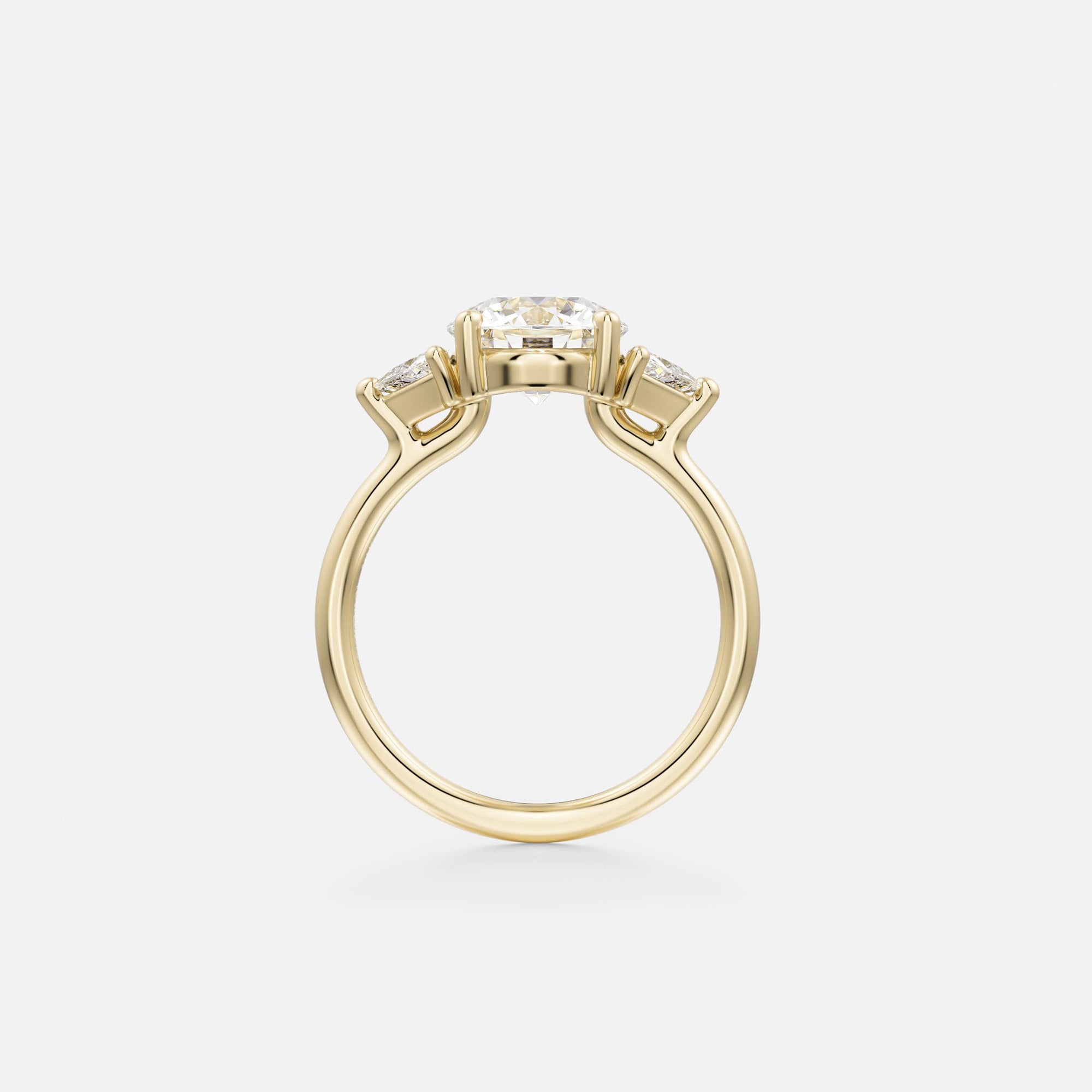 side view of round brilliant diamond three stone engagement ring with trillion-cut side diamonds on thin round band