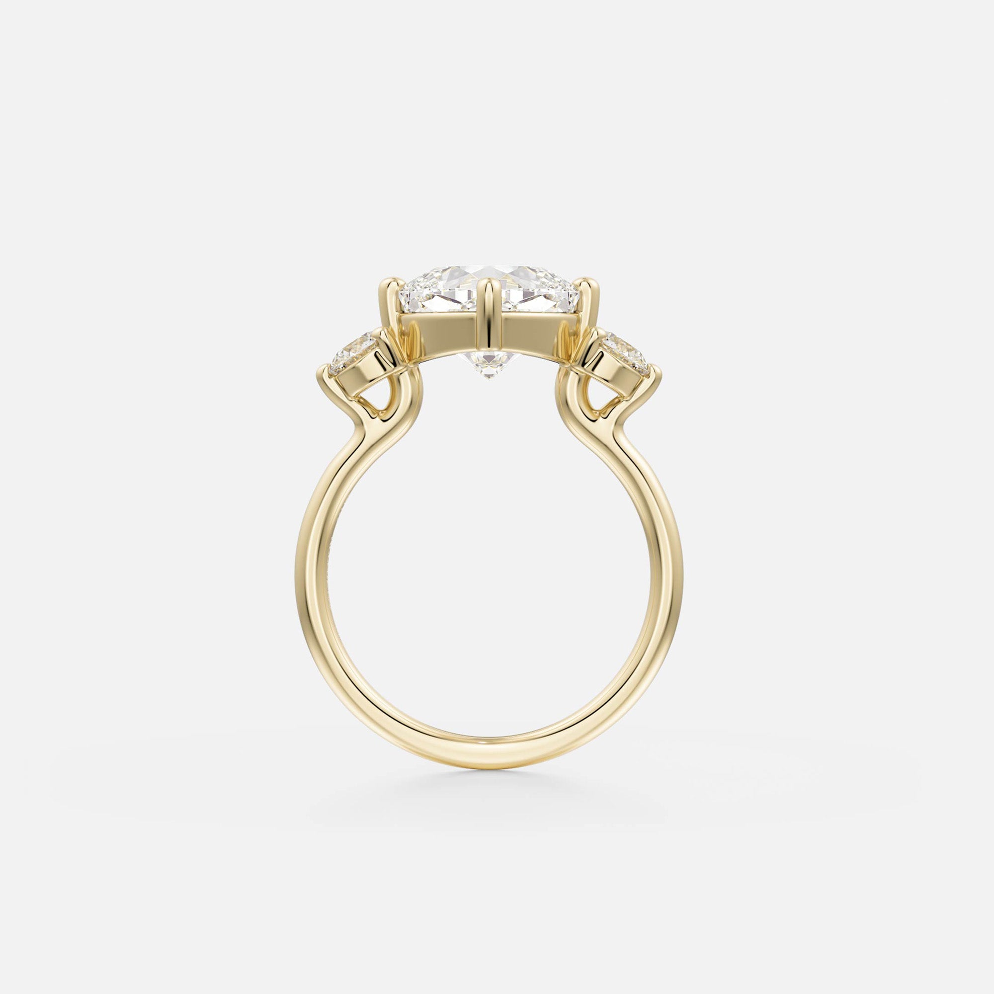14 karat yellow gold engagement ring with tilted cushion-cut diamond in compass prong setting on slender round band