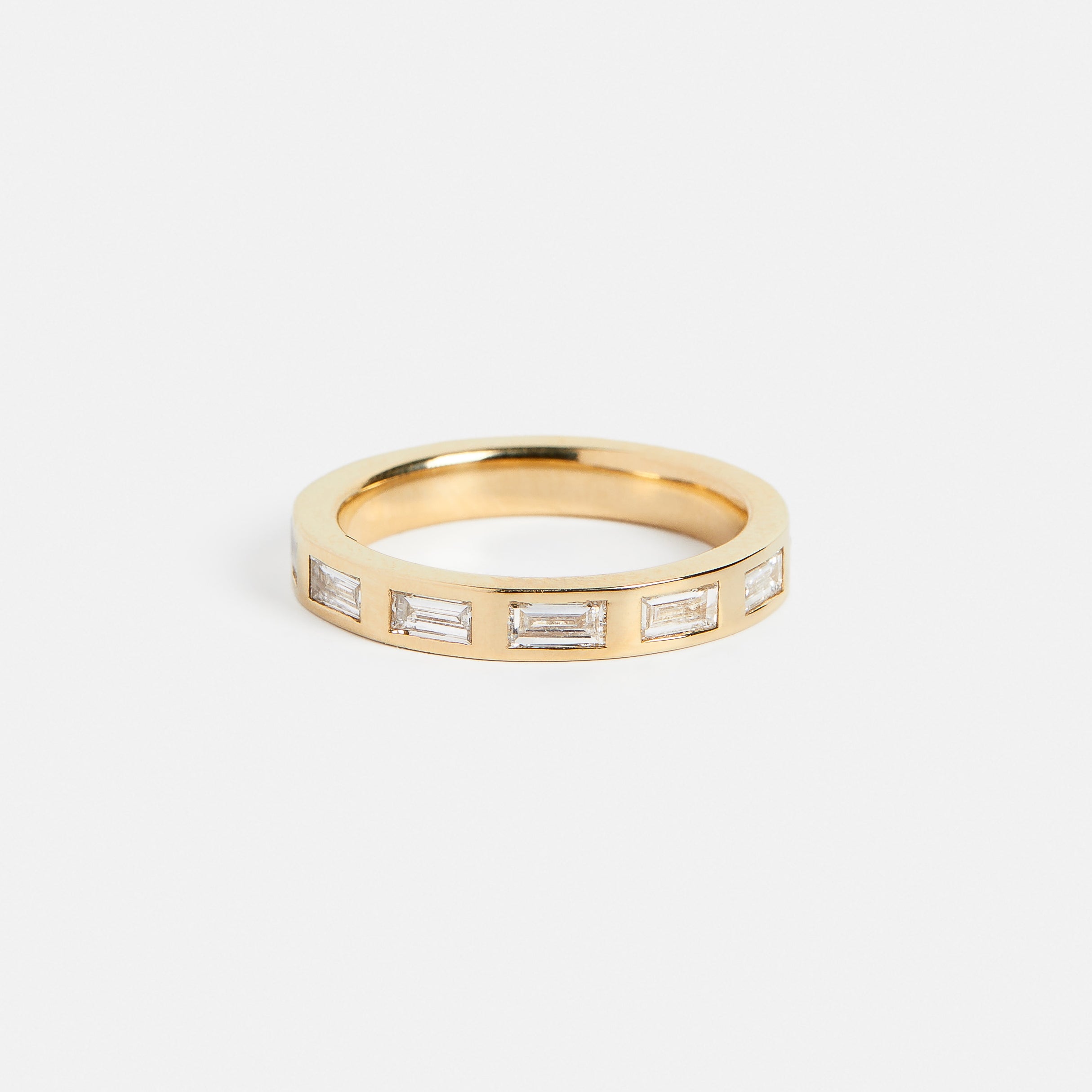 14k yellow gold eternity wedding band with baguette-cut white diamonds