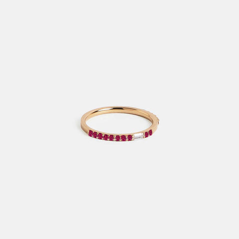 14k yellow gold thin eternity band with round rubies and white diamond baguettes