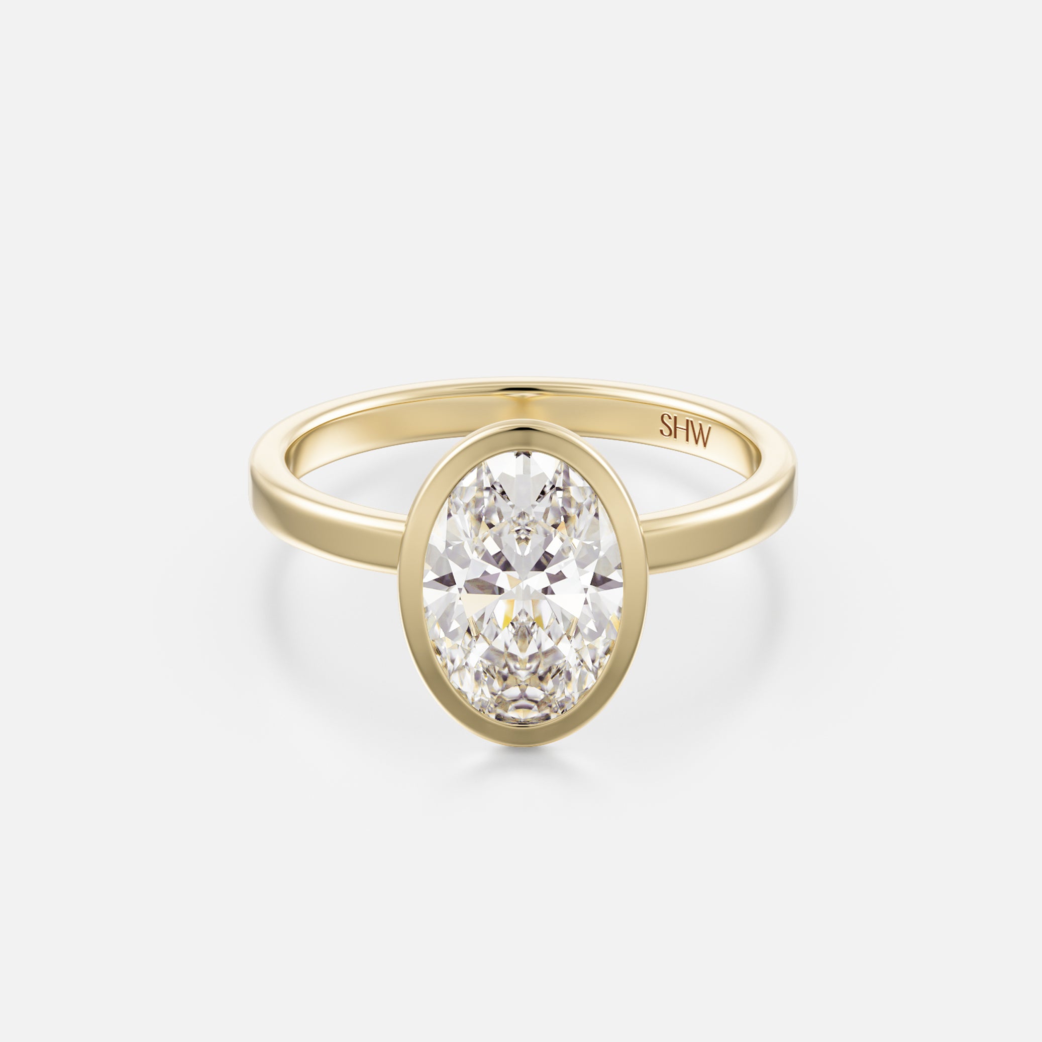 14k yellow gold thin flat band engagement ring with 2 carat north-south oval diamond in bezel setting