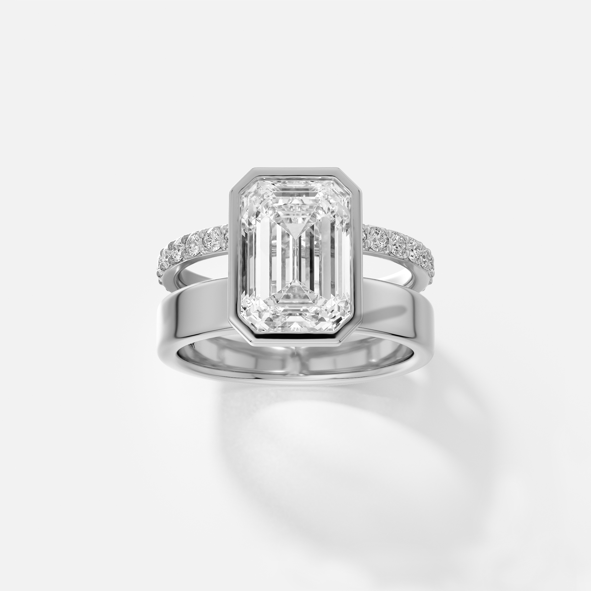 platinum engagement ring with 4.00 carat emerald-cut diamond in bezel setting and pavé diamond eternity band on double band