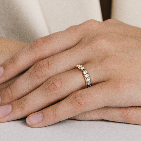Minimal pavé diamond wedding band shown worn in natural light