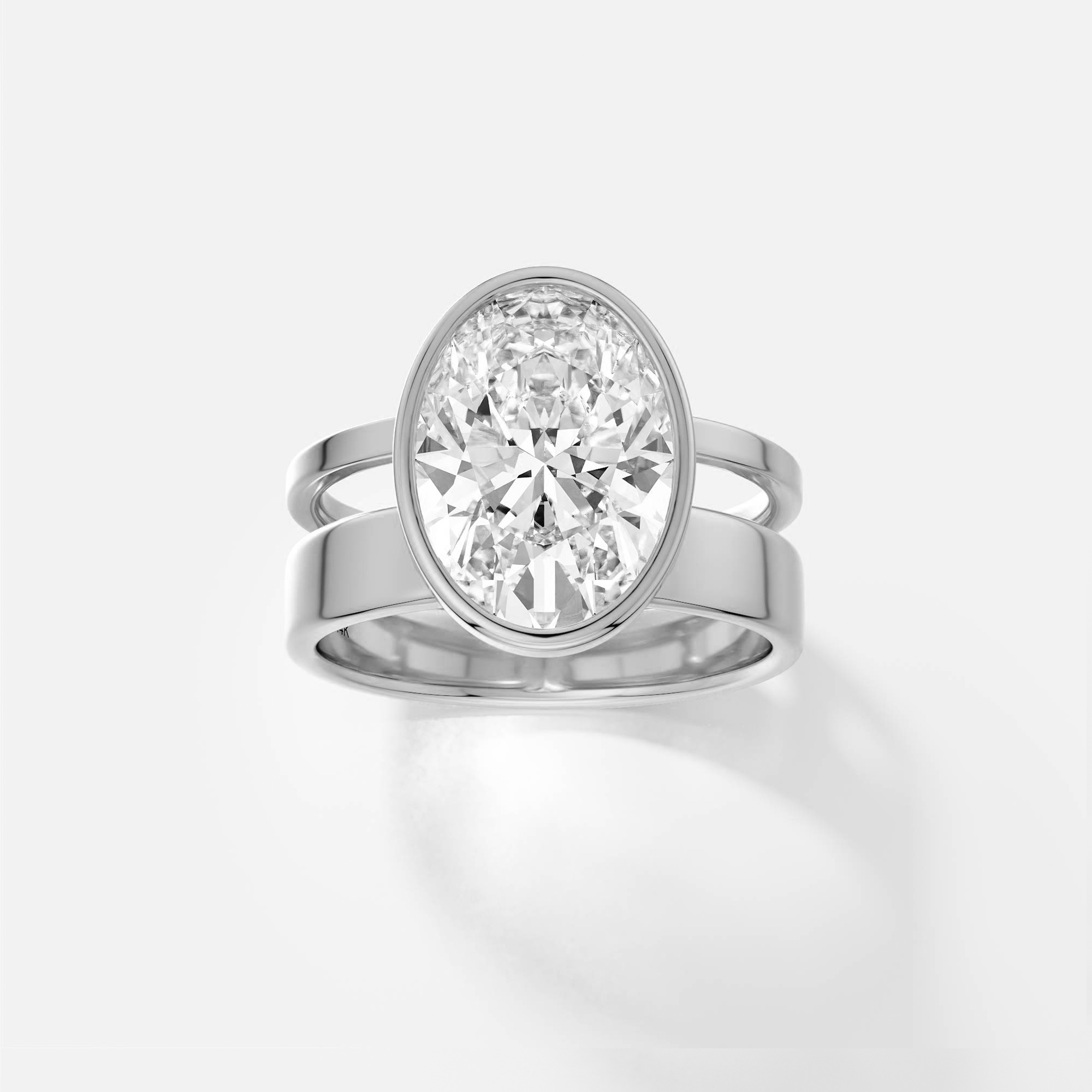 platinum engagement ring with 4.00 carat oval diamond in bezel setting on modern connected double band