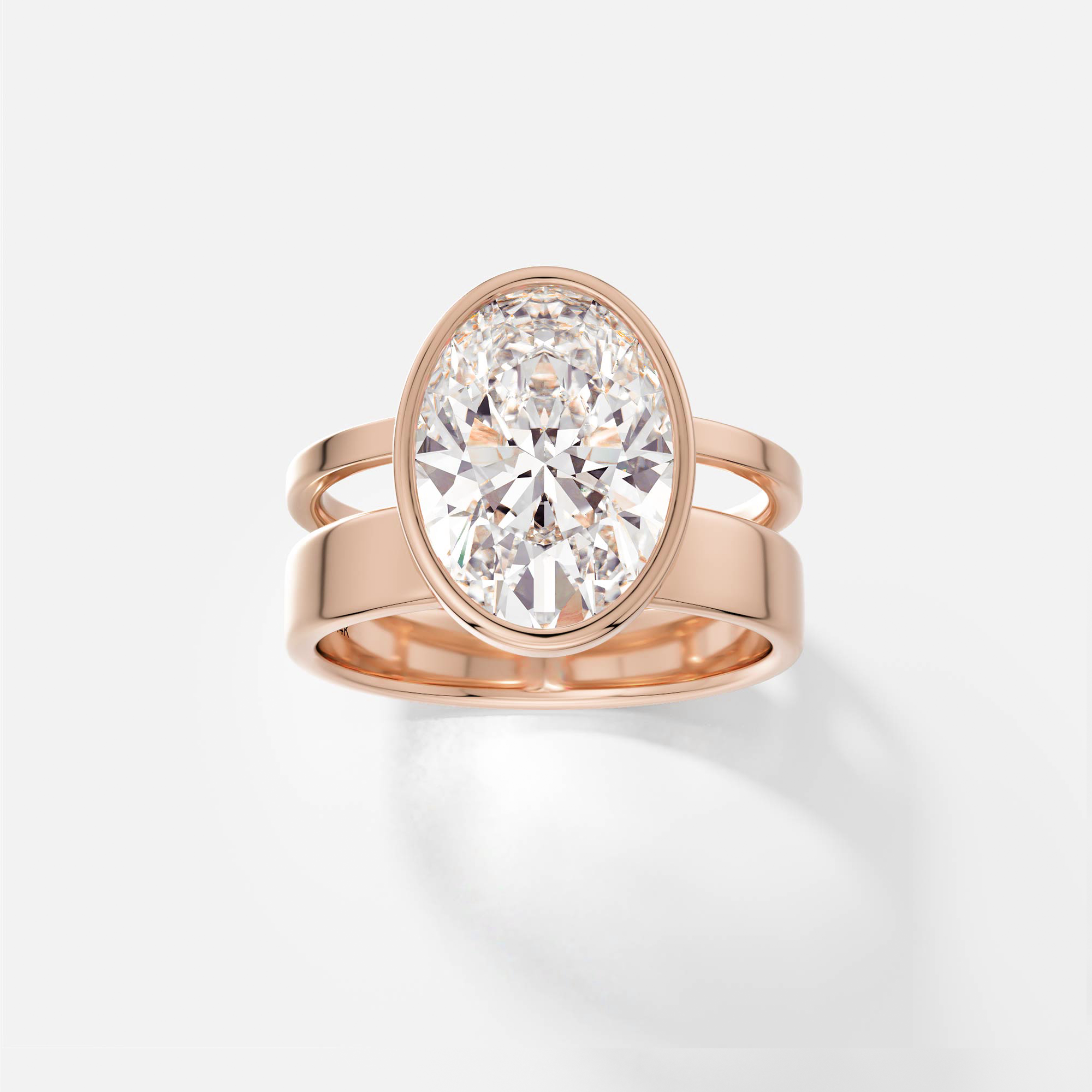 14k rose gold engagement ring with 4 carat oval diamond bezel set on contemporary double band design