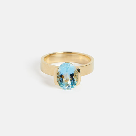 Unique Partially Bezel Set Tabs Engagement Ring with blue aquamarine gemstone in 14k yellow gold by SHW best fine jewelry store in NYC near me