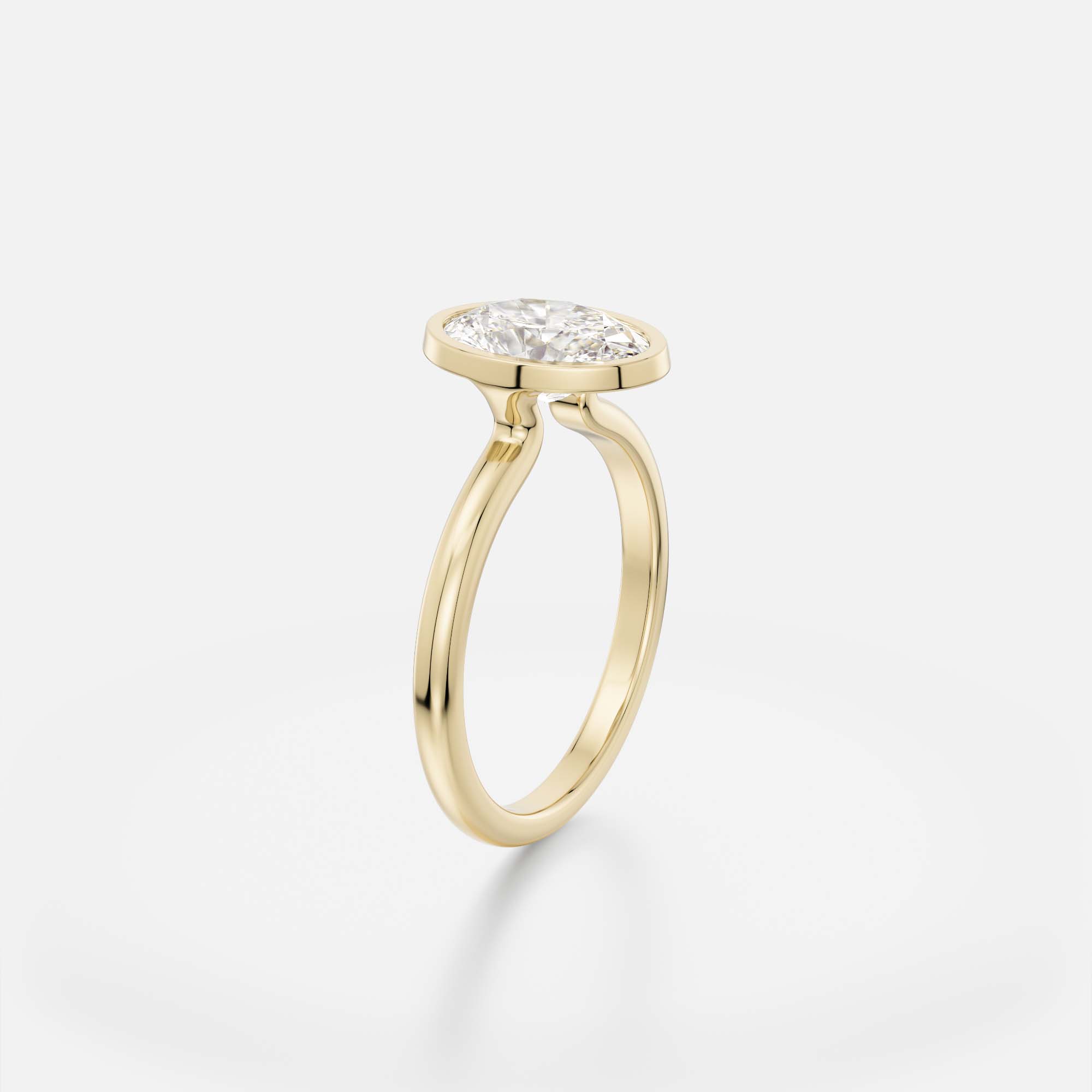 1.50 carat oval diamond engagement ring with slim bezel setting and open profile on domed band