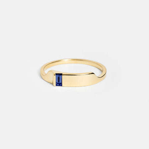 14k yellow gold slim ring with baguette-cut blue sapphire