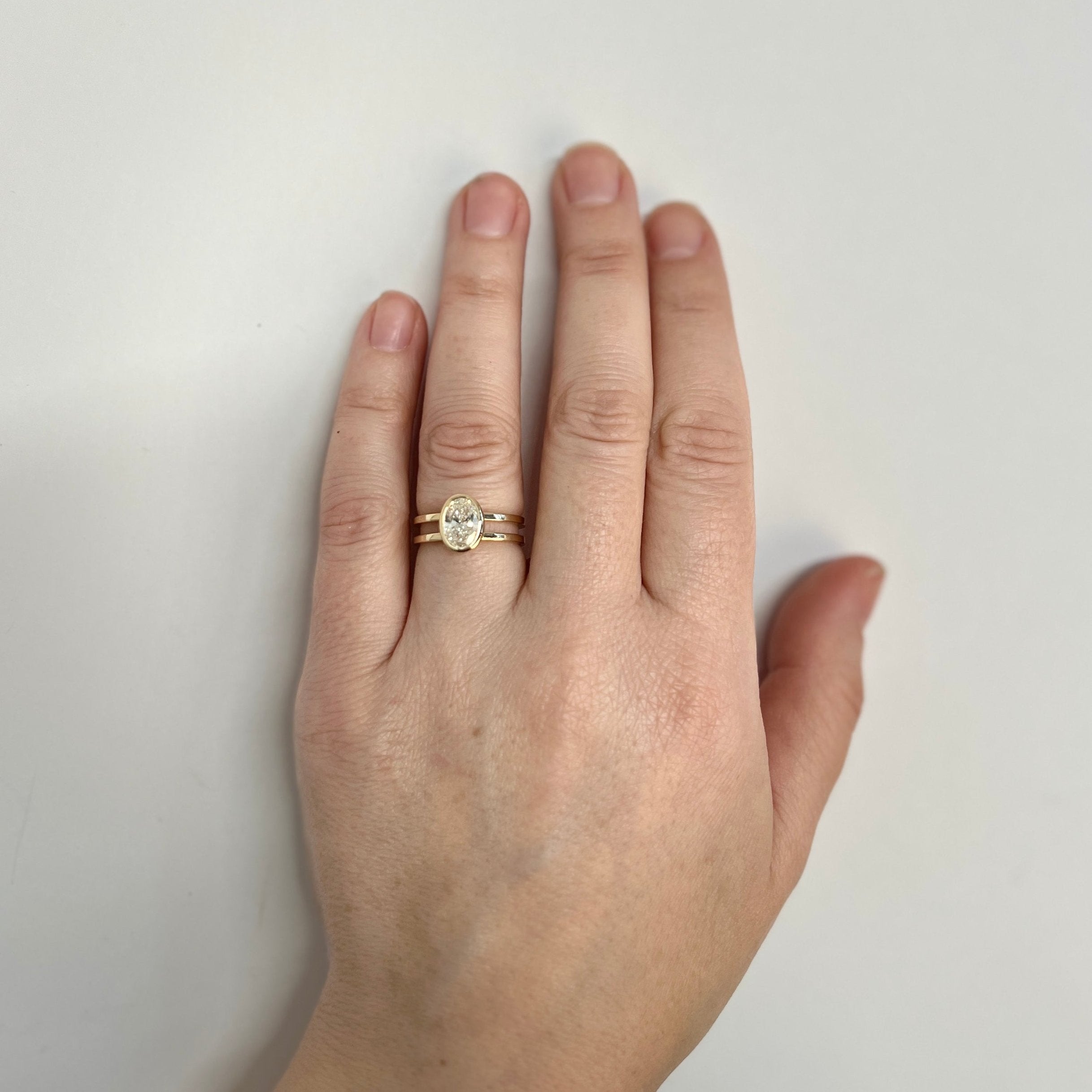 Simple Double-band bezel set engagement ring with 1 carat oval laboratory diamond in 14k yellow gold by SHW cool jewelry stores in NYC SoHo