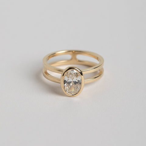 Unique Bezel Set Engagement Ring with one carat oval cut lab grown diamond in 14k yellow gold by SHW best fine jewelry stores in NYC near me