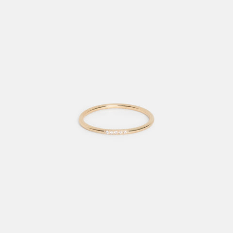 14k yellow gold thin round wedding band with five pavé white diamonds