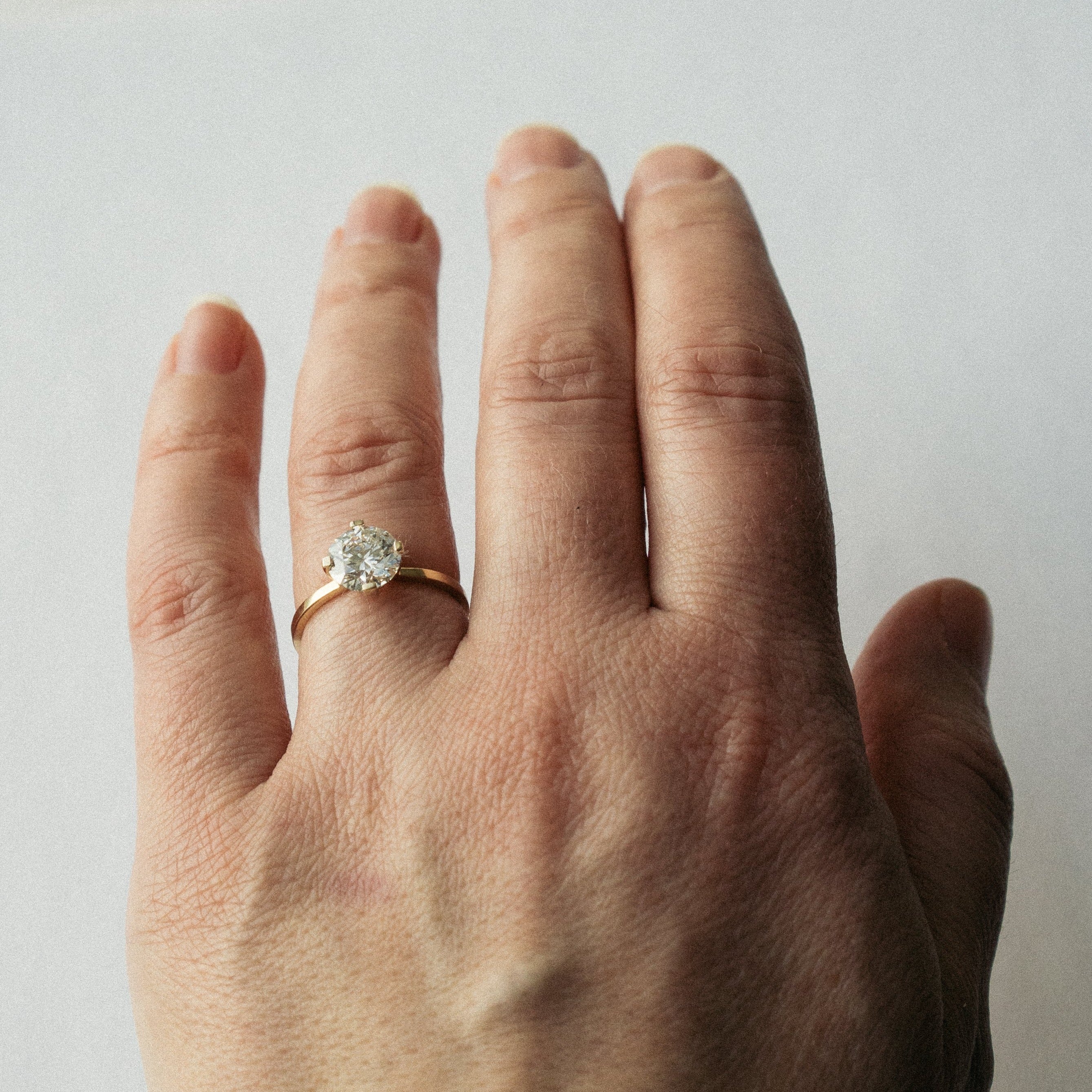 Simple Delicate Claws engagement ring with 1.5 carat lab grown diamond in 14k yellow gold by SHW fine jewelry Manhattan NYC