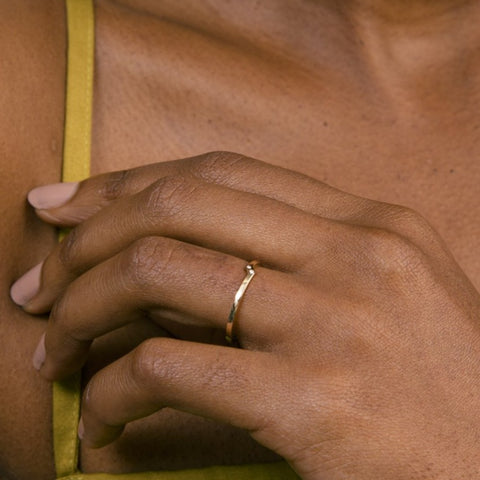 Slim double band ring with two white diamonds worn on hand