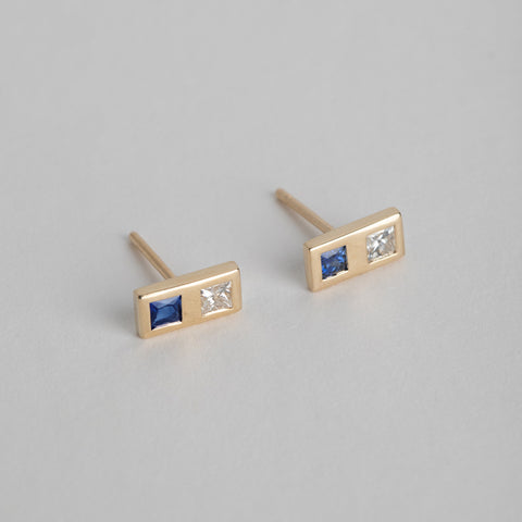 14 karat yellow gold designer earrings set with diamond and sapphire