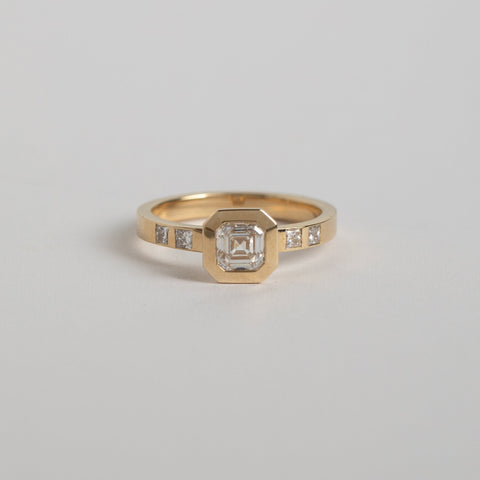 Designer Velta Ring 14k yellow gold set in 14k Yellow Gold with a 0.75ct F color VS2 clarity square emerald cut lab created diamond and princess cut diamonds on side made in NYC by SHW fine Jewlery