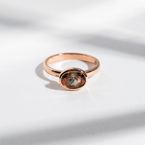 Syd Unconventional Ring in 14k Gold set with a 1.2ct oval cut andalusite By SHW Fine Jewelry NYC