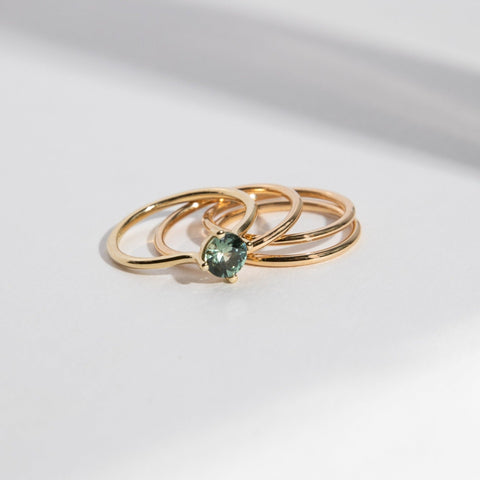 Velu Simple Ring in 14k Gold set with a 0.8ct green round brilliant cut sapphire By SHW Fine Jewelry NYC